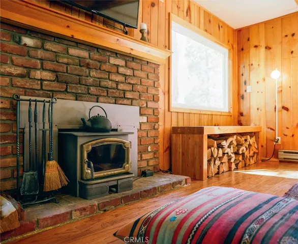 a bedroom with a bed and a fireplace