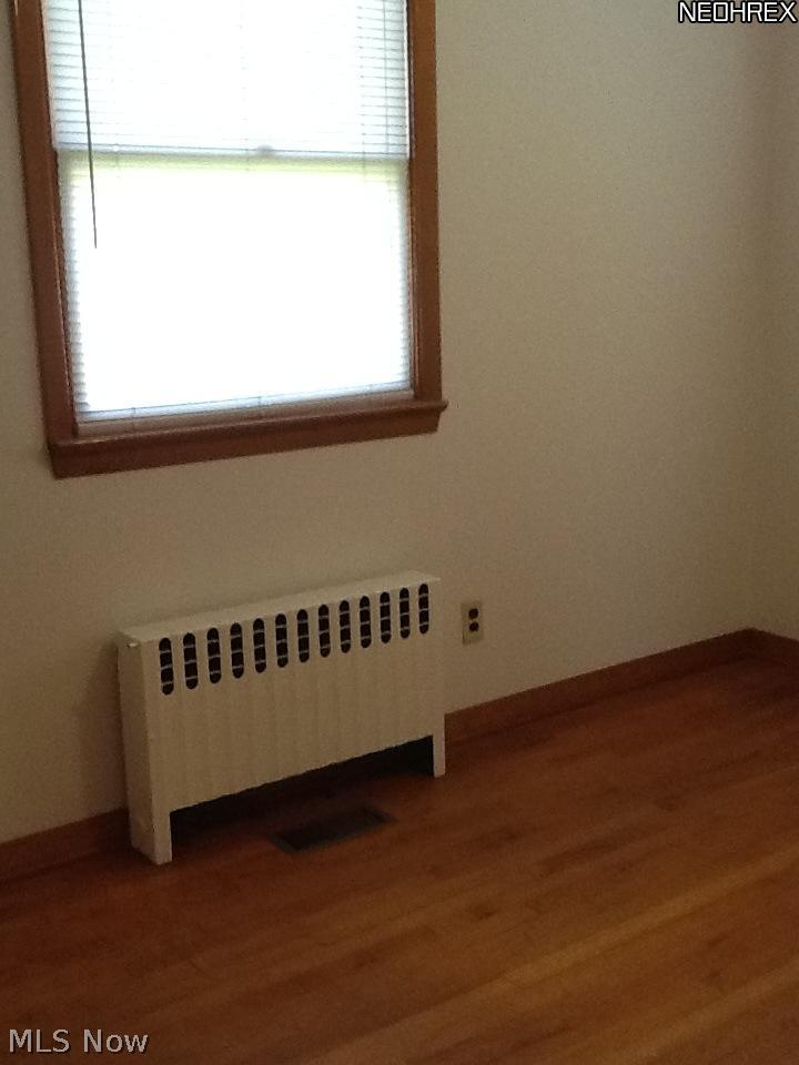 9850 West Pleasant Valley Road Parma, OH 44130 - Photo 14 of 15 Bedroom 2 on the first floor has gleaming hardwood flooring.
