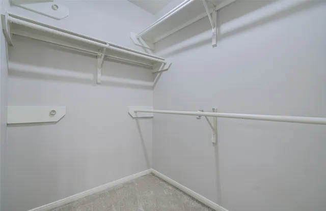 a view of an empty walk in closet