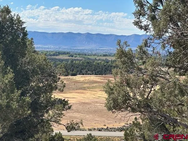 a view of a lake with mountains in the background