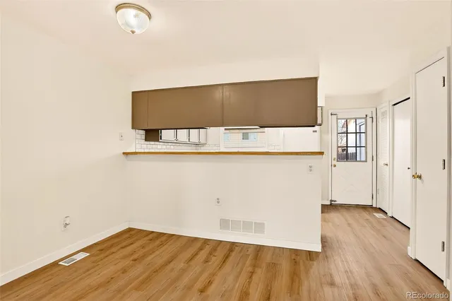 a view of a livingroom with wooden floor