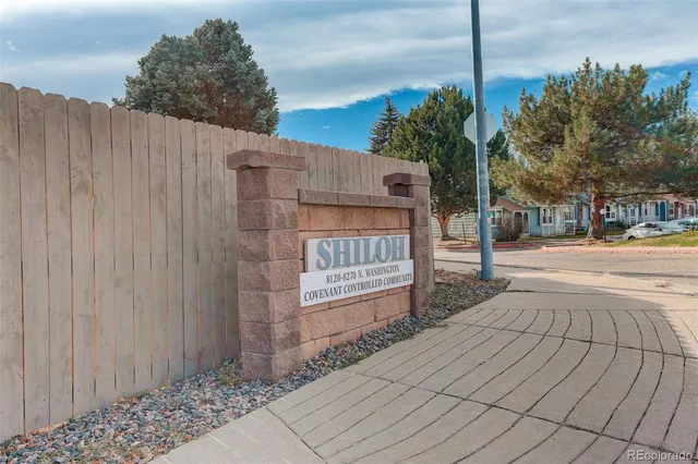 a sign board with yard