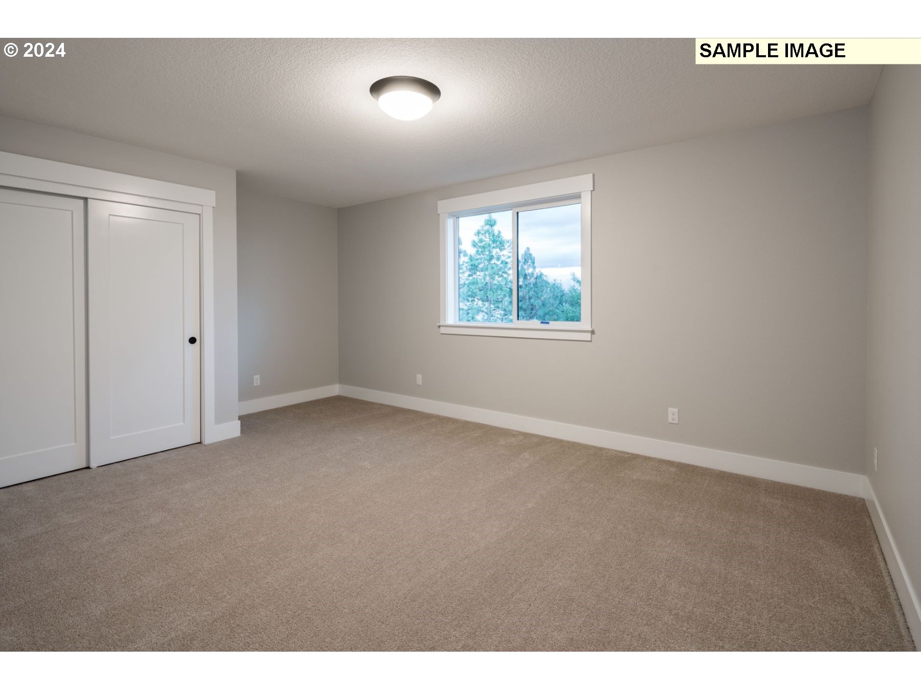 1202 South 46th Place Ridgefield, WA 98642 - Photo 17 of 25 a view of an empty room with a window