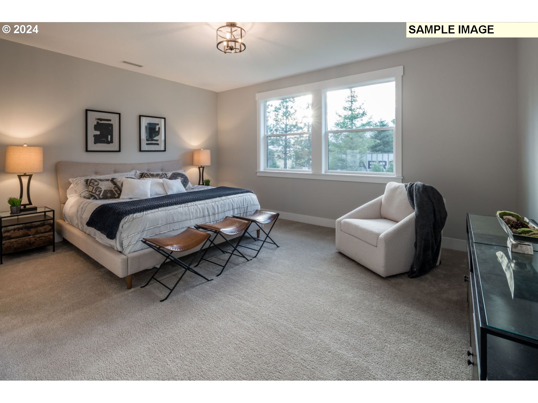 1202 South 46th Place Ridgefield, WA 98642 - Photo 10 of 25 a spacious bedroom with a bed and a couch