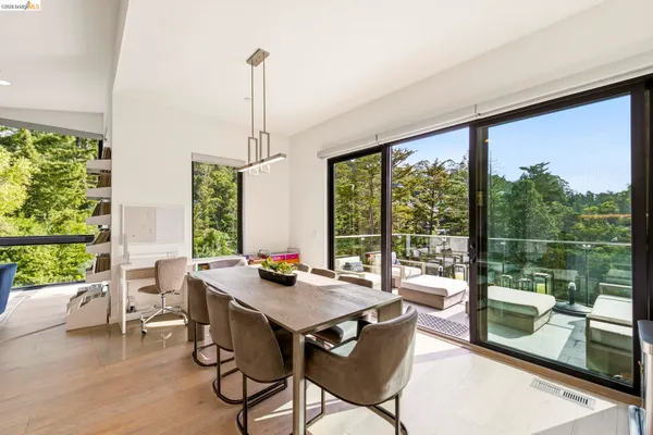 a view of a dining room with furniture window and outside view
