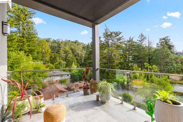 a view of a balcony with lake view and a potted plant