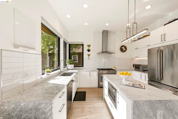 a kitchen with a stove and a sink