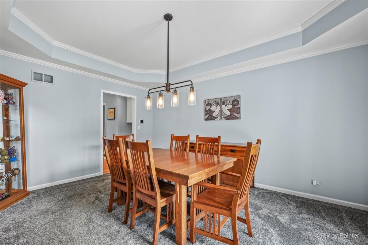 7104 Dove Way Cary, IL 60013 - Photo 9 of 82 a dining room with furniture and chandelier
