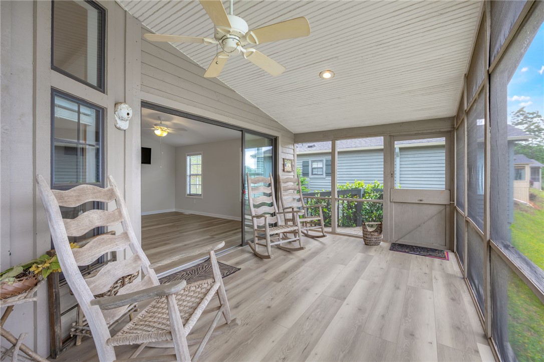 1230 Melton Road, Unit 25 West Union, SC 29696 - Photo 2 of 46 A well-lit screened porch offers relaxation and views of the surrounding neighborhood.