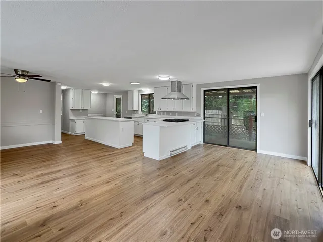 a view of kitchen and wooden floor