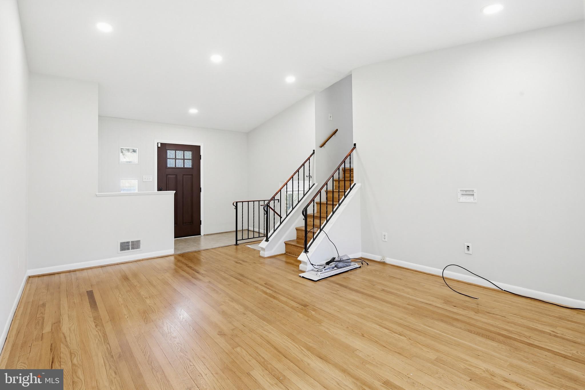 9717 Hedin Drive Silver Spring, MD 20903 - Photo 11 of 36 a view of a room with wooden floor