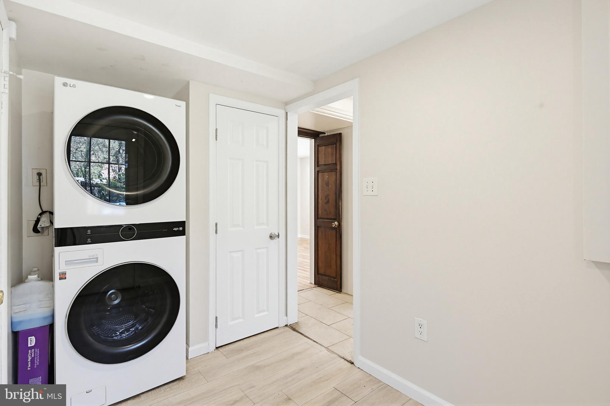 9717 Hedin Drive Silver Spring, MD 20903 - Photo 13 of 36 a view of a livingroom with washer and dryer