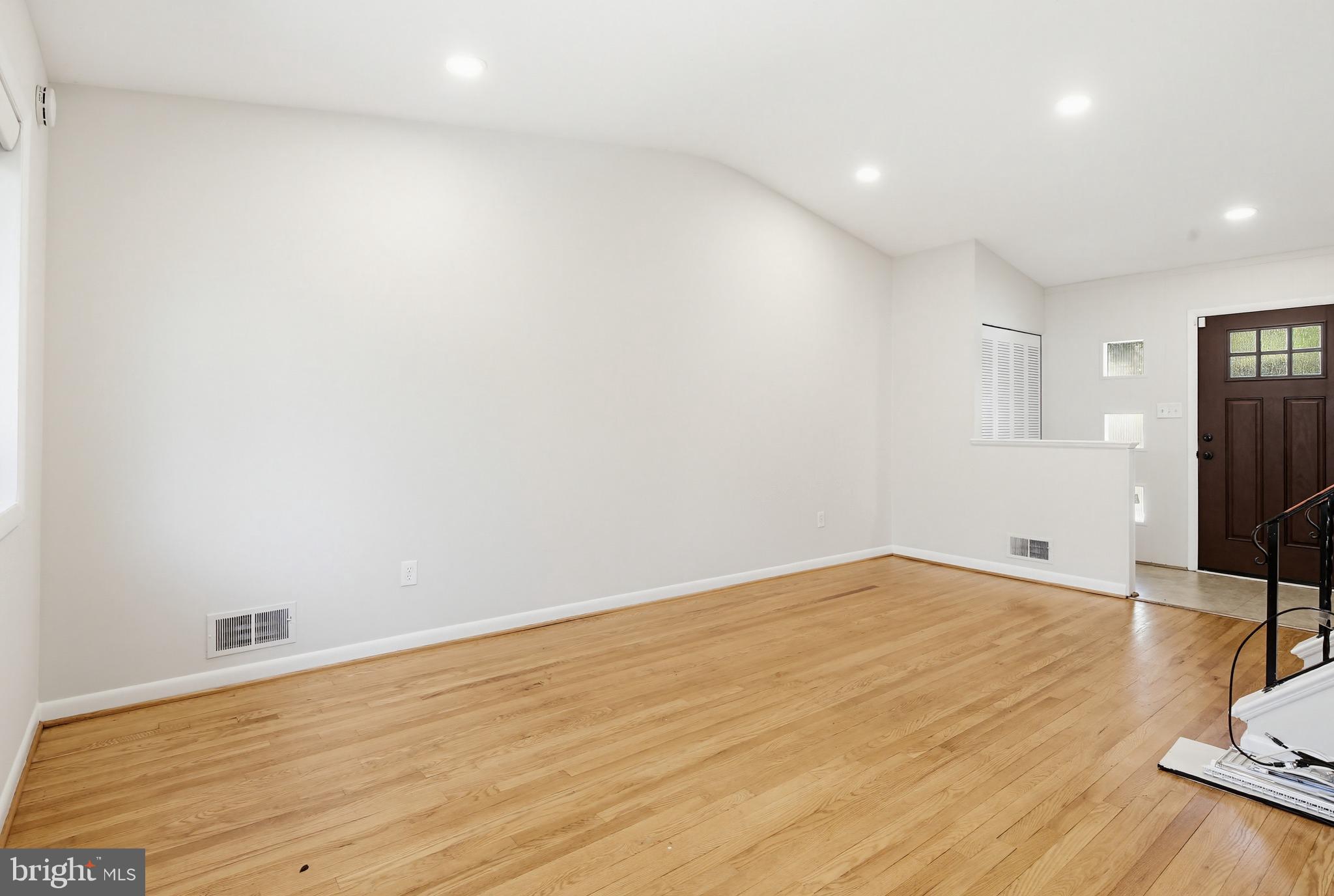 9717 Hedin Drive Silver Spring, MD 20903 - Photo 18 of 36 a view of empty room with wooden floor and fan