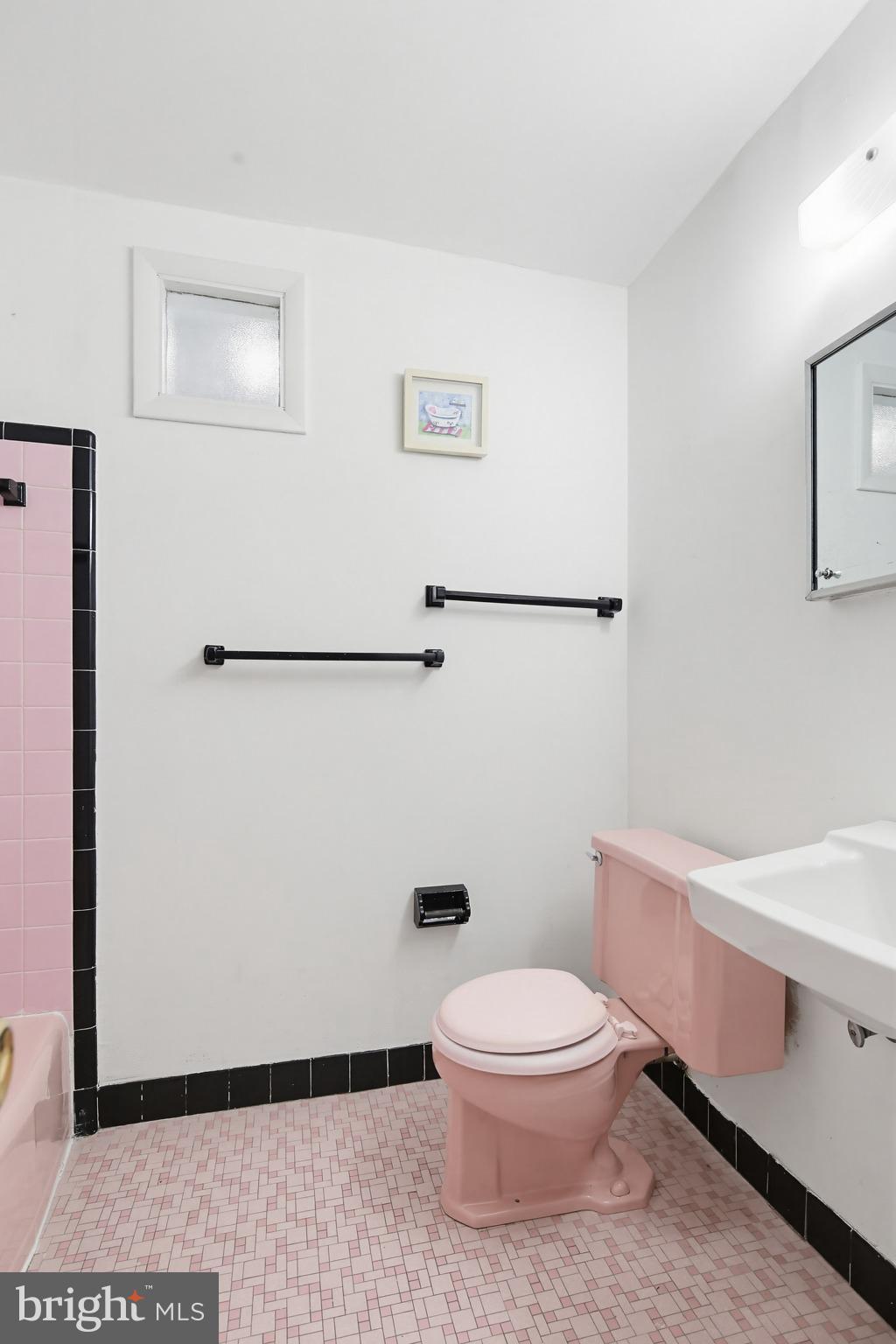 9717 Hedin Drive Silver Spring, MD 20903 - Photo 20 of 36 a white toilet sitting next to a bathroom sink