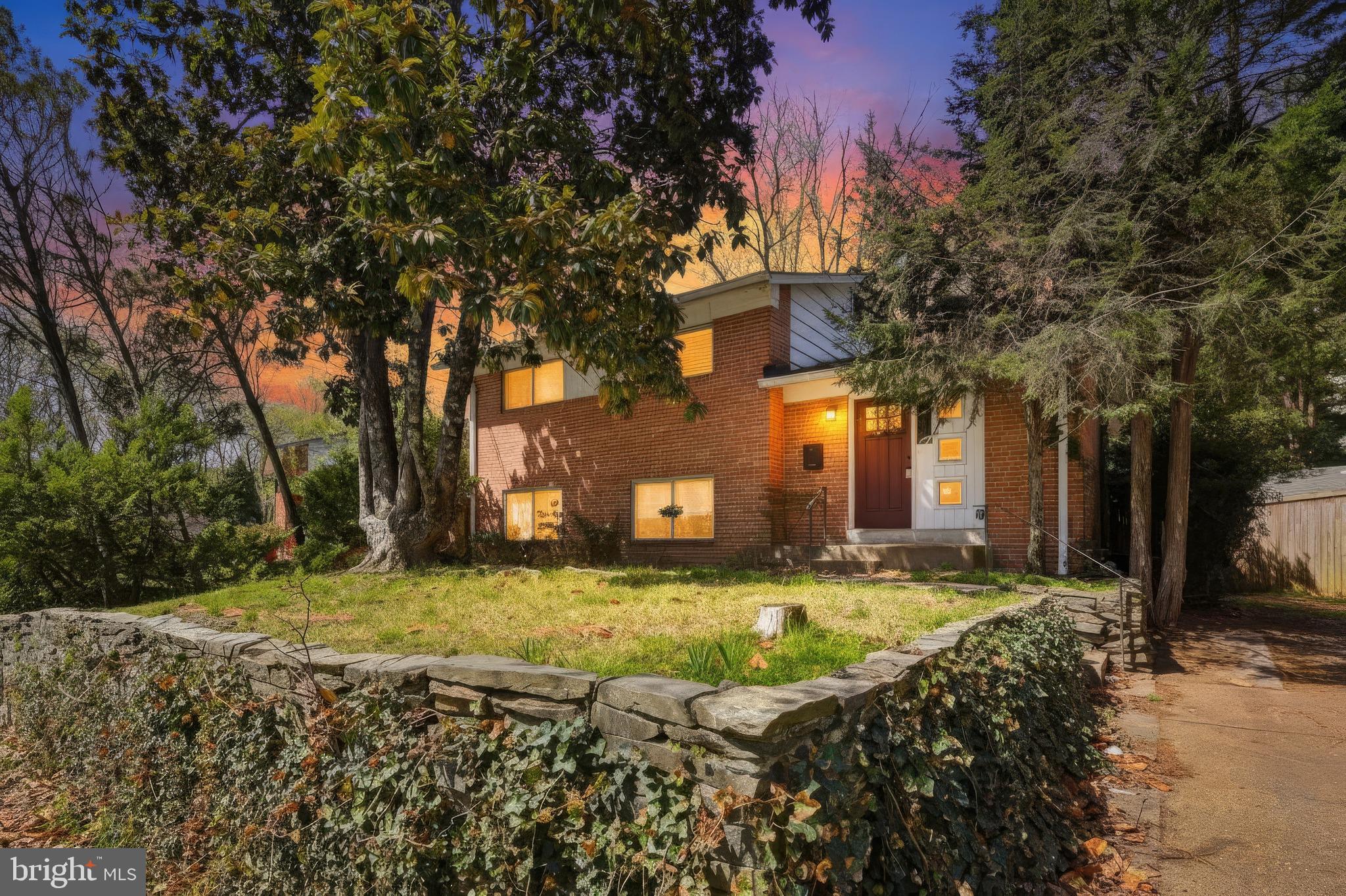 9717 Hedin Drive Silver Spring, MD 20903 - Photo 2 of 36 a view of a house with a yard