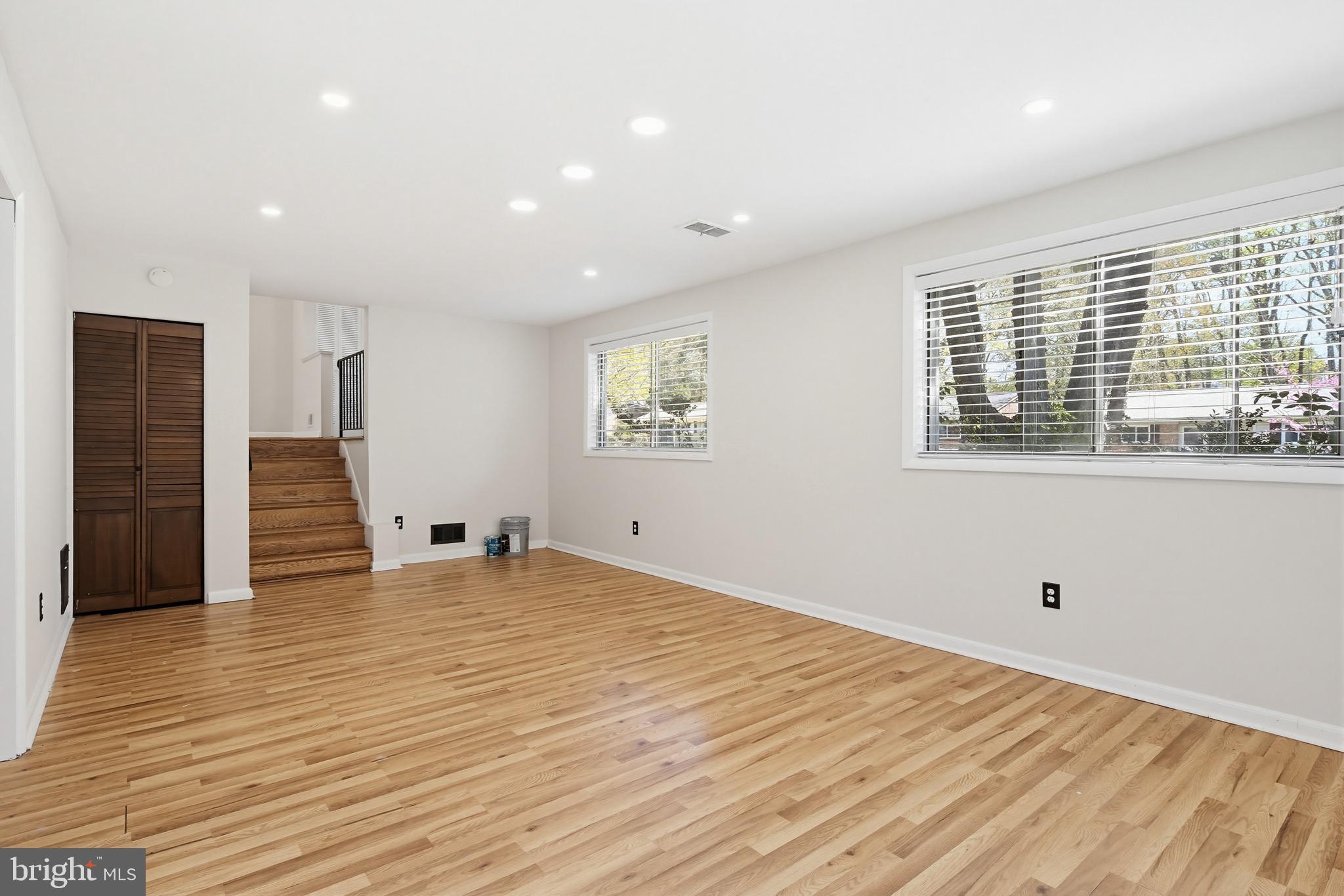 9717 Hedin Drive Silver Spring, MD 20903 - Photo 8 of 36 a view of empty room with wooden floor and fan