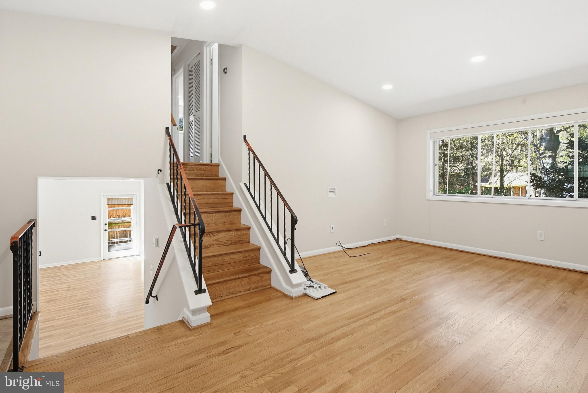 9717 Hedin Drive Silver Spring, MD 20903 - Photo 9 of 36 a view of entryway and hall with wooden floor