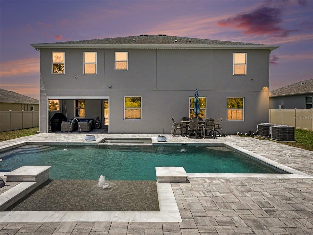 5270 Obsidian Gate Road Mount Dora, FL 32757 - Photo 3 of 50 a house view with a garden space