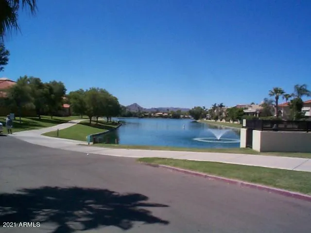 a view of a golf course with a lake