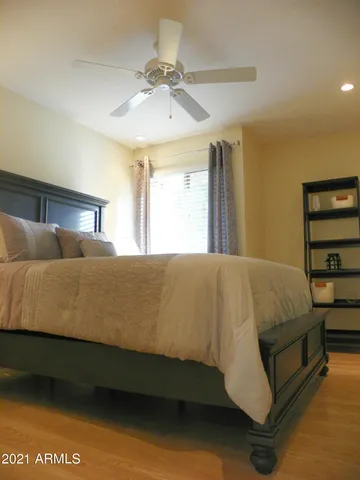 a bedroom with a bed and window