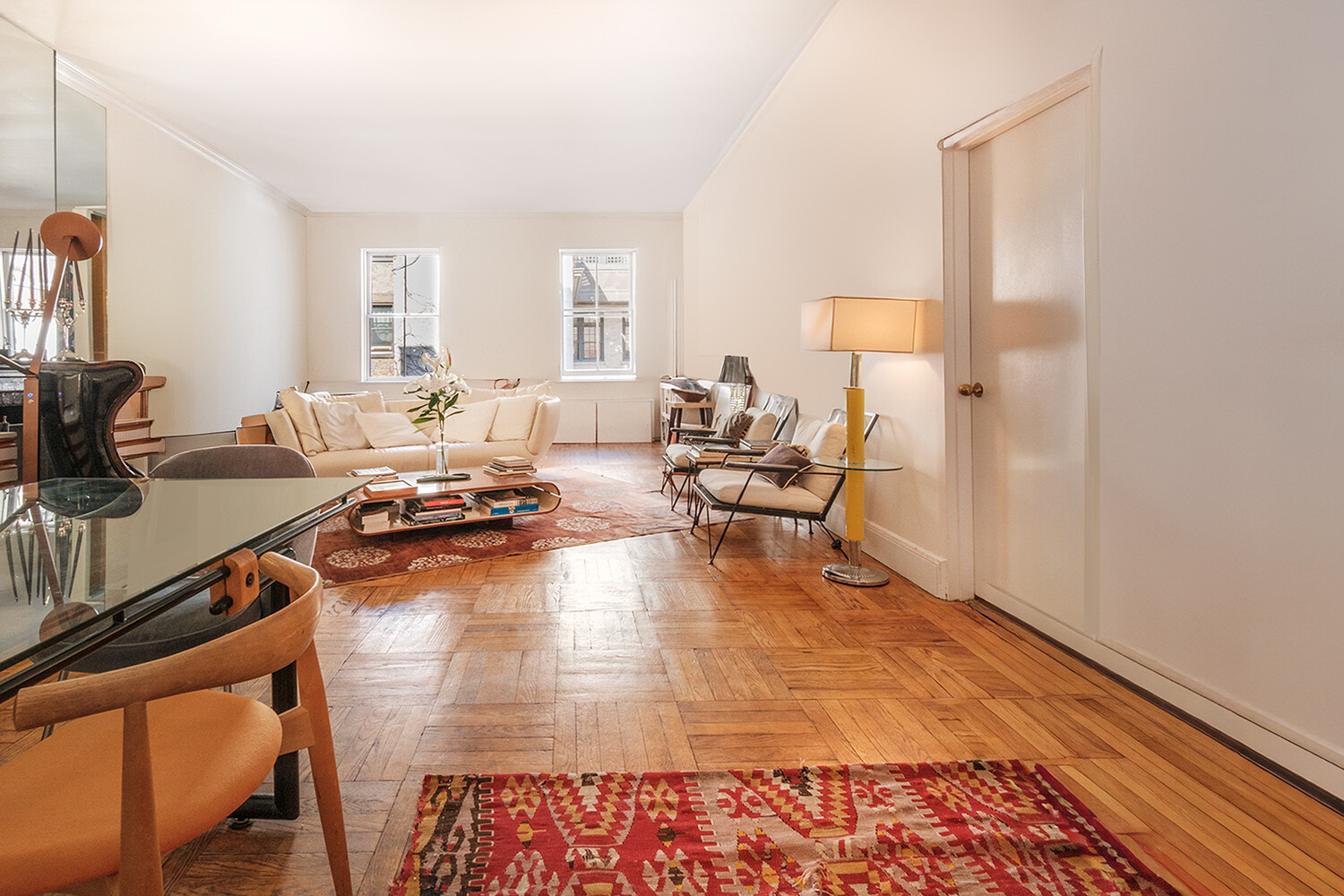 25 East 69th Street, Unit 5B Manhattan, NY 10021 - Photo 4 of 22 a living room with furniture and a wooden floor