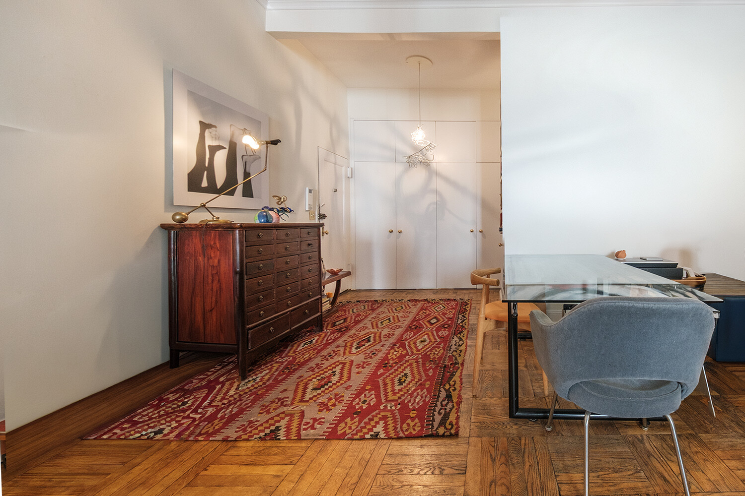 25 East 69th Street, Unit 5B Manhattan, NY 10021 - Photo 7 of 22 a living room with a couch and chairs