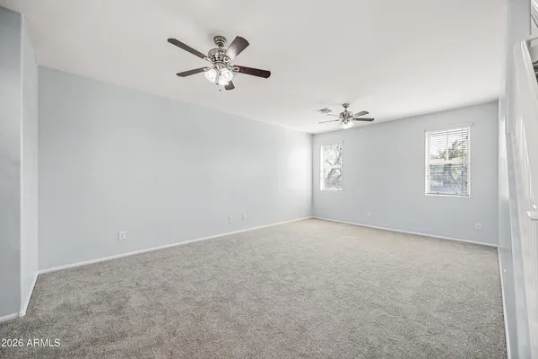 an a ceiling fan with kitchen view