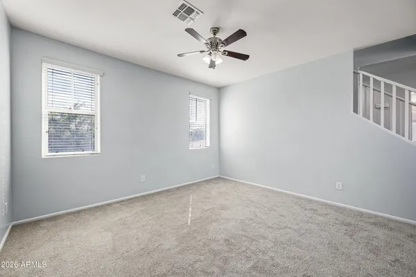 a living room with furniture potted plant and a chandelier
