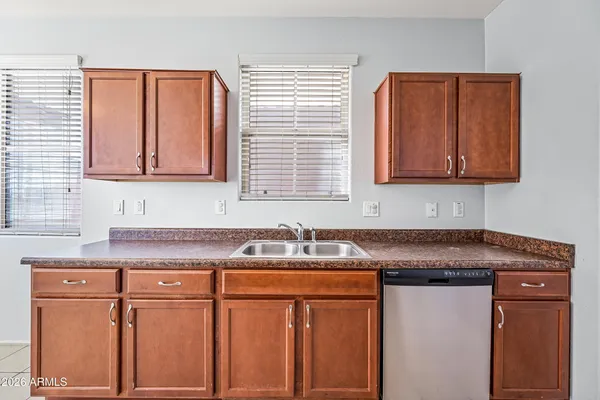 a kitchen with stainless steel appliances a refrigerator and stove