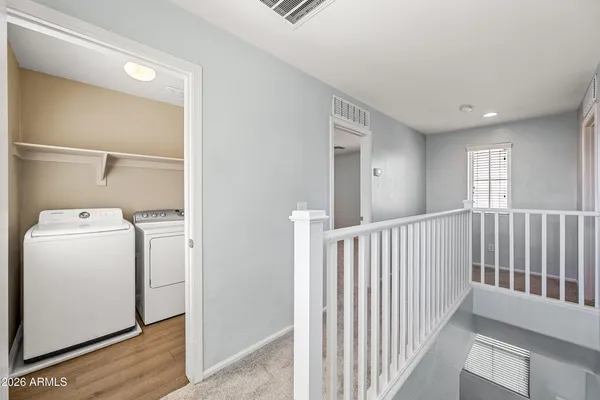 a view of a bathroom from a hallway