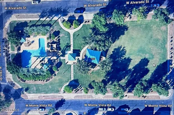 a view of a tree in front of a house