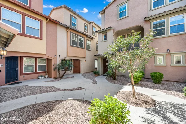 a view of a pathway along the house