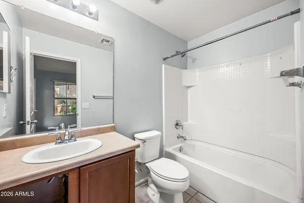 a view of a street with a building in the background