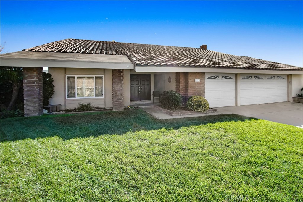 front view of a house with a yard