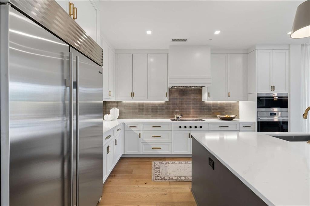 2520 Peachtree Road, Unit 603 Atlanta, GA 30305 - Photo 15 of 91 a kitchen with a refrigerator sink and cabinets