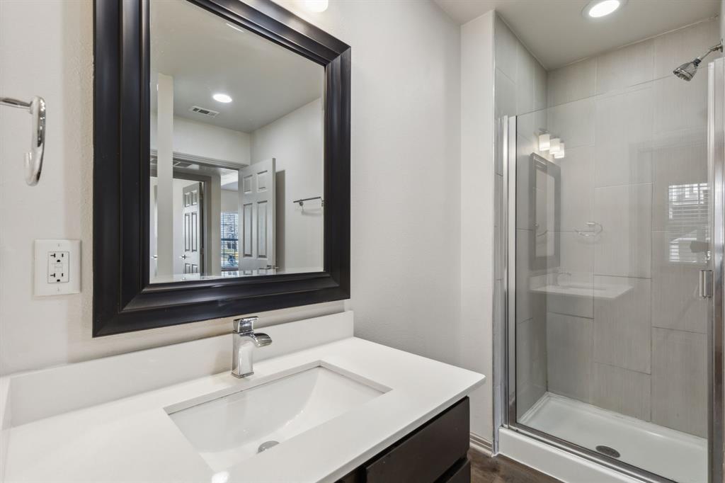 4402 Swiss Avenue Dallas, TX 75204 - Photo 5 of 11 a bathroom with a sink and a mirror