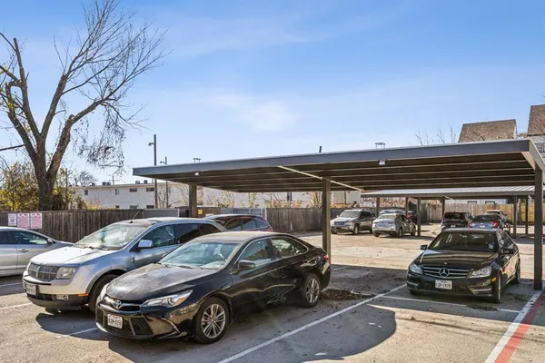a view of parking with cars parked
