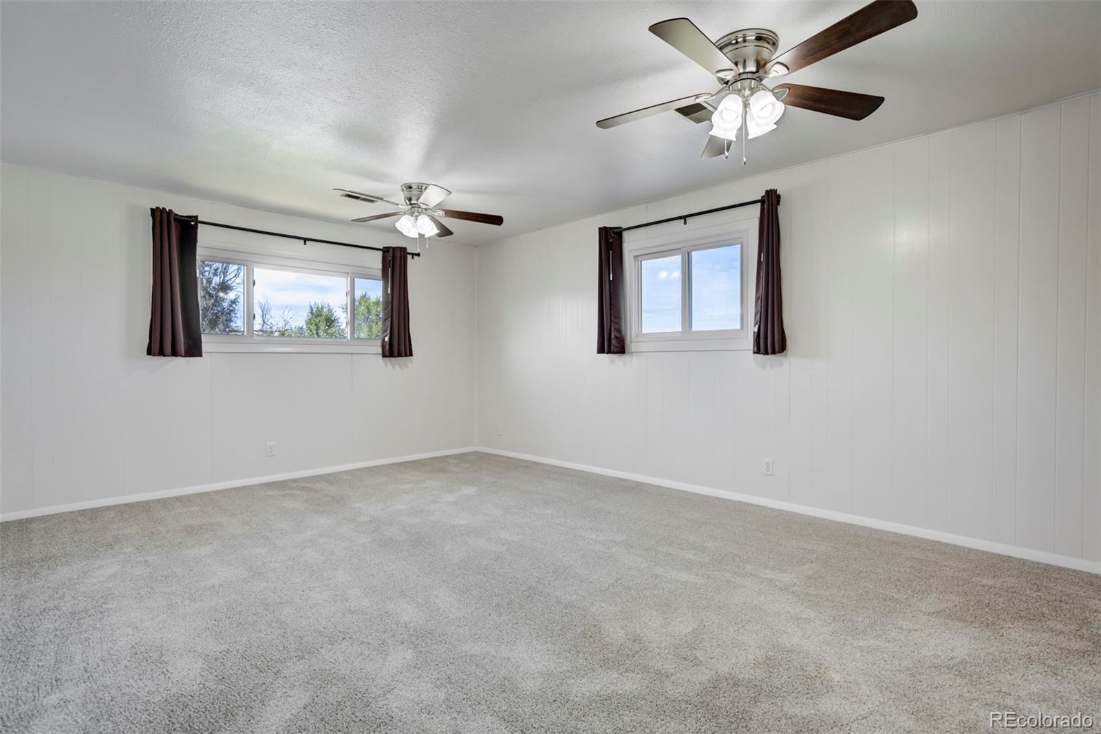 1284 Thompson Street Limon, CO 80828 - Photo 13 of 49 a view of an empty room with a window