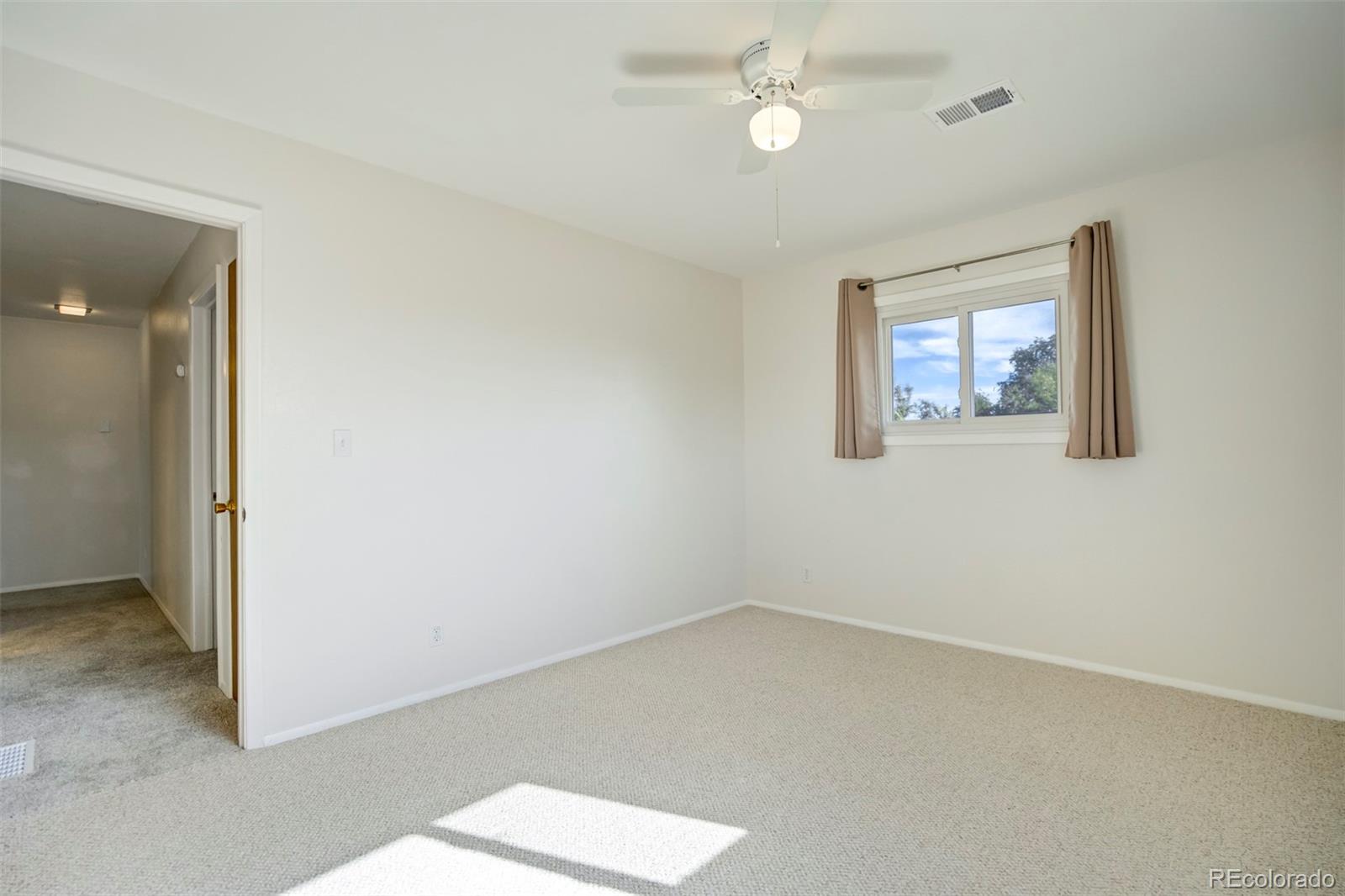 1284 Thompson Street Limon, CO 80828 - Photo 21 of 49 an empty room with a window