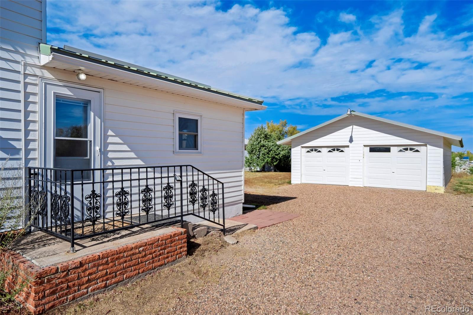 1284 Thompson Street Limon, CO 80828 - Photo 27 of 49 a view of a house with a wooden fence