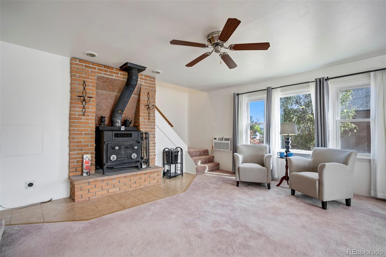 1284 Thompson Street Limon, CO 80828 - Photo 3 of 49 a living room with furniture and a floor to ceiling window