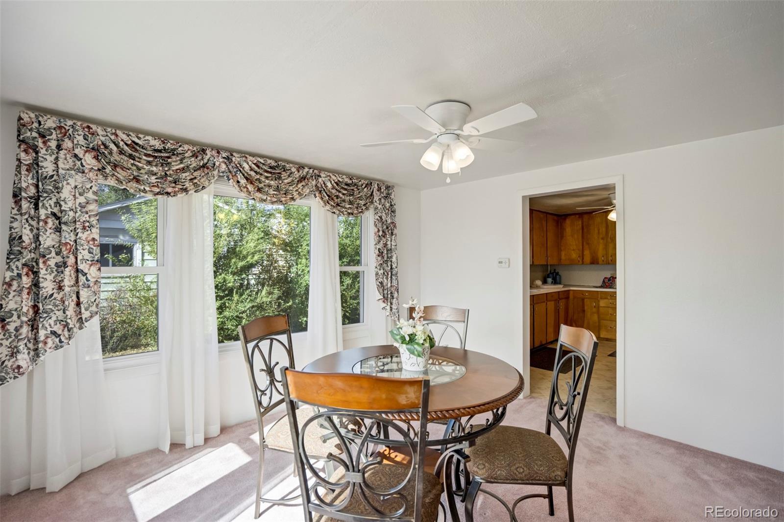 1284 Thompson Street Limon, CO 80828 - Photo 40 of 49 a view of a dining room with furniture window and outside view