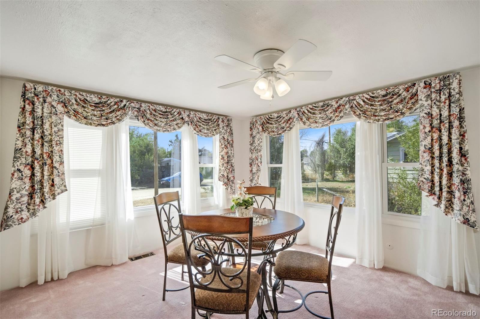 1284 Thompson Street Limon, CO 80828 - Photo 6 of 49 a view of a dining room with furniture window and outside view