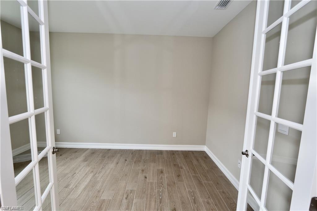 1063 Enbrook Loop Naples, FL 34114 - Photo 11 of 26 a view of an empty walk in closet