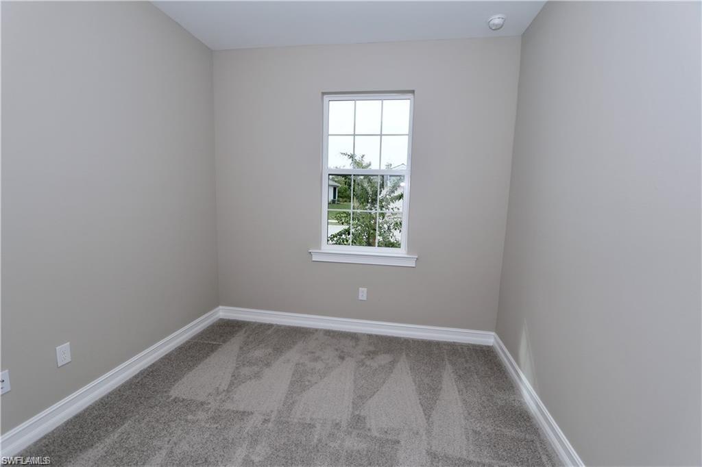 1063 Enbrook Loop Naples, FL 34114 - Photo 14 of 26 an empty room with a window