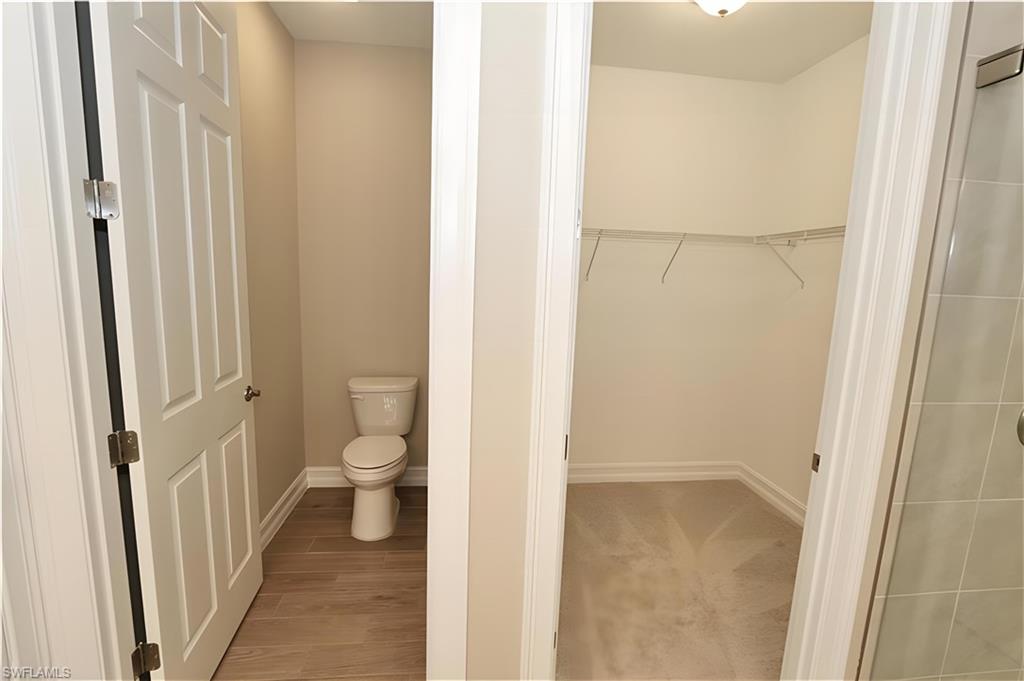 1063 Enbrook Loop Naples, FL 34114 - Photo 17 of 26 a bathroom with a toilet