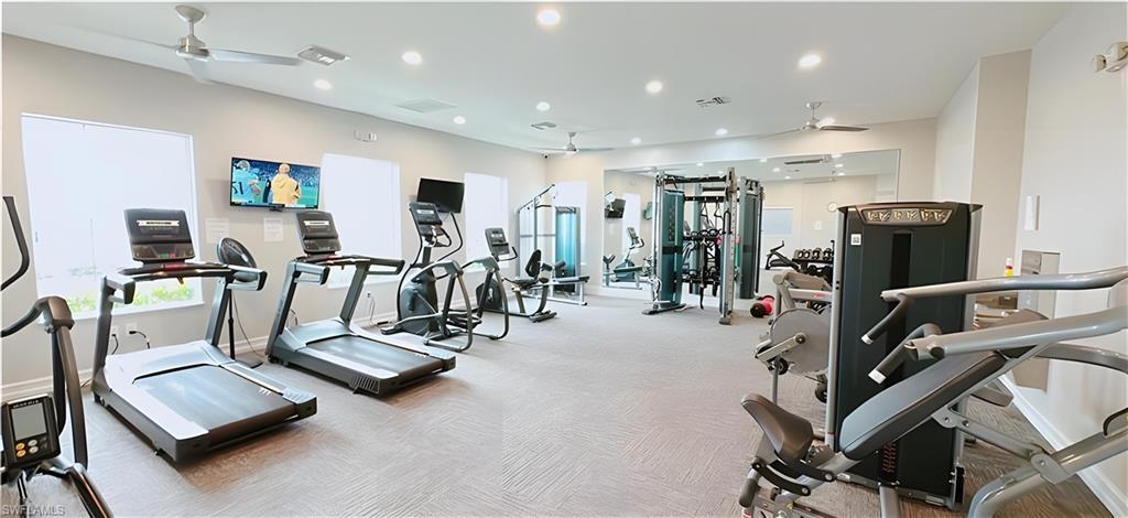 1063 Enbrook Loop Naples, FL 34114 - Photo 23 of 26 a view of a room with gym equipment