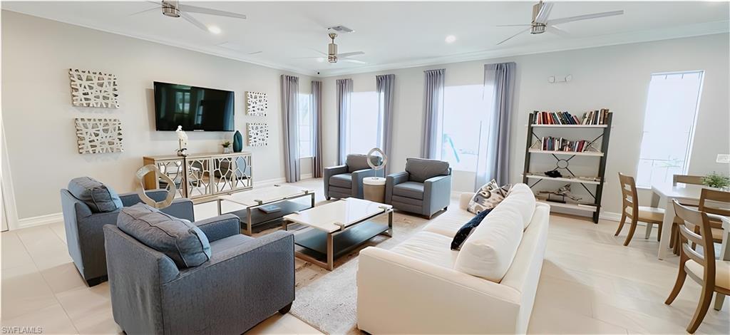 1063 Enbrook Loop Naples, FL 34114 - Photo 24 of 26 a living room with furniture and a flat screen tv