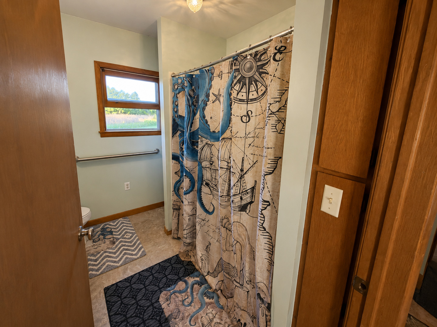 0 North 1900th Street Mount Carmel, IL 62863 - Photo 21 of 50 a bathroom with a bathtub and shower curtain