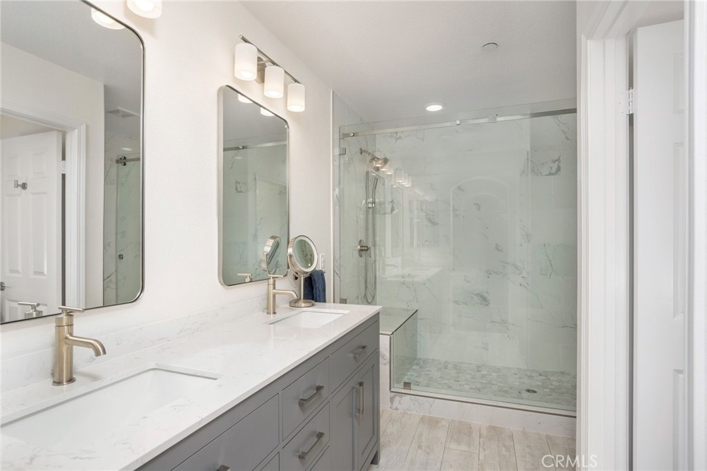 3604 Dunkirk Drive Oxnard, CA 93035 - Photo 11 of 32 a bathroom with a double vanity sink mirror and shower